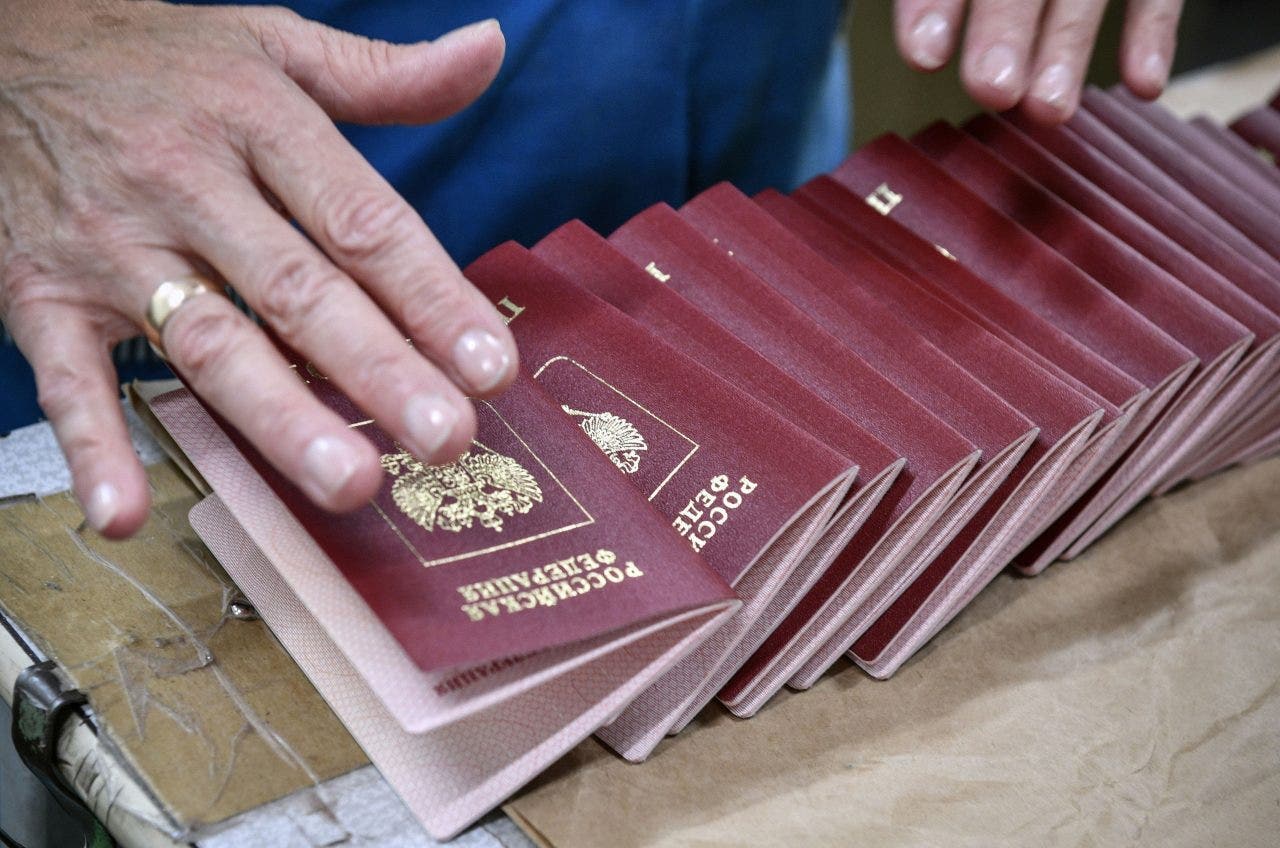 Russian officials having passports seized due to flight concerns