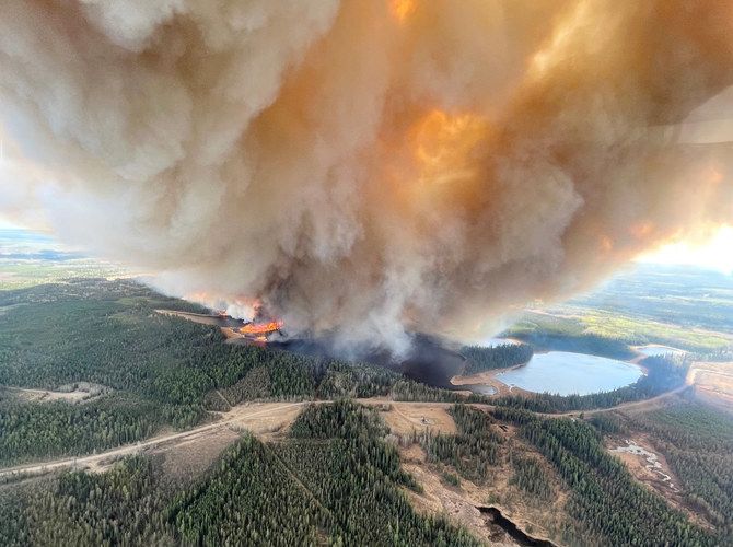 Fire and floods across western Canada force evacuations